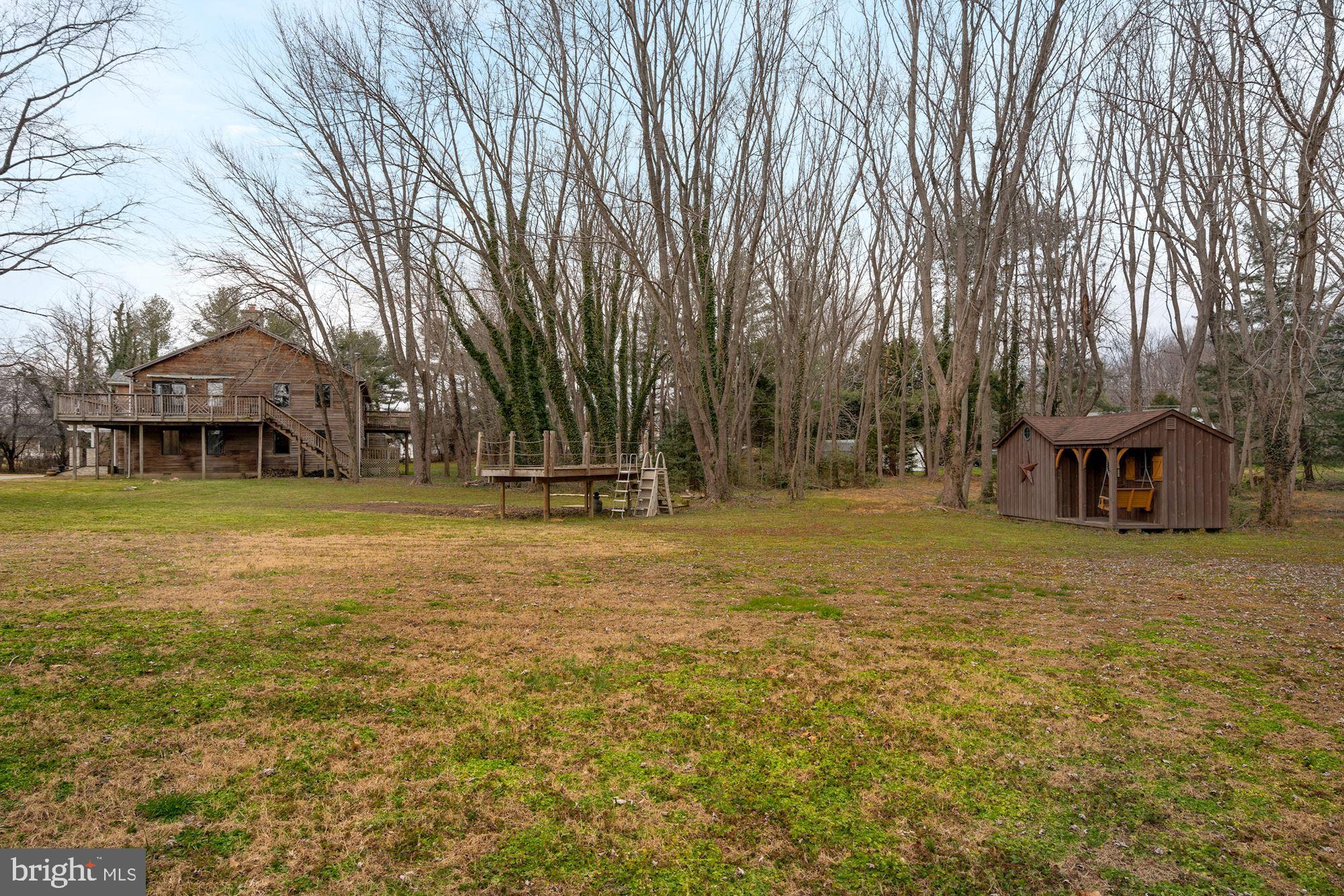 6823 Old Solomons Island Road Friendship, MD 20758 - Photo 36 of 41 Side view with play shed and level lot