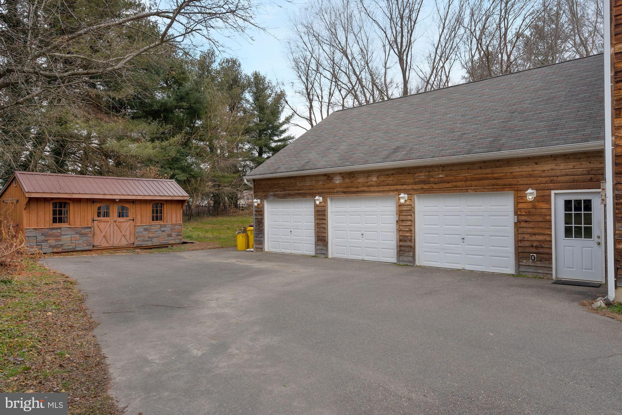 6823 Old Solomons Island Road Friendship, MD 20758 - Photo 37 of 41 Large shed, huge 3 car garage with workshop