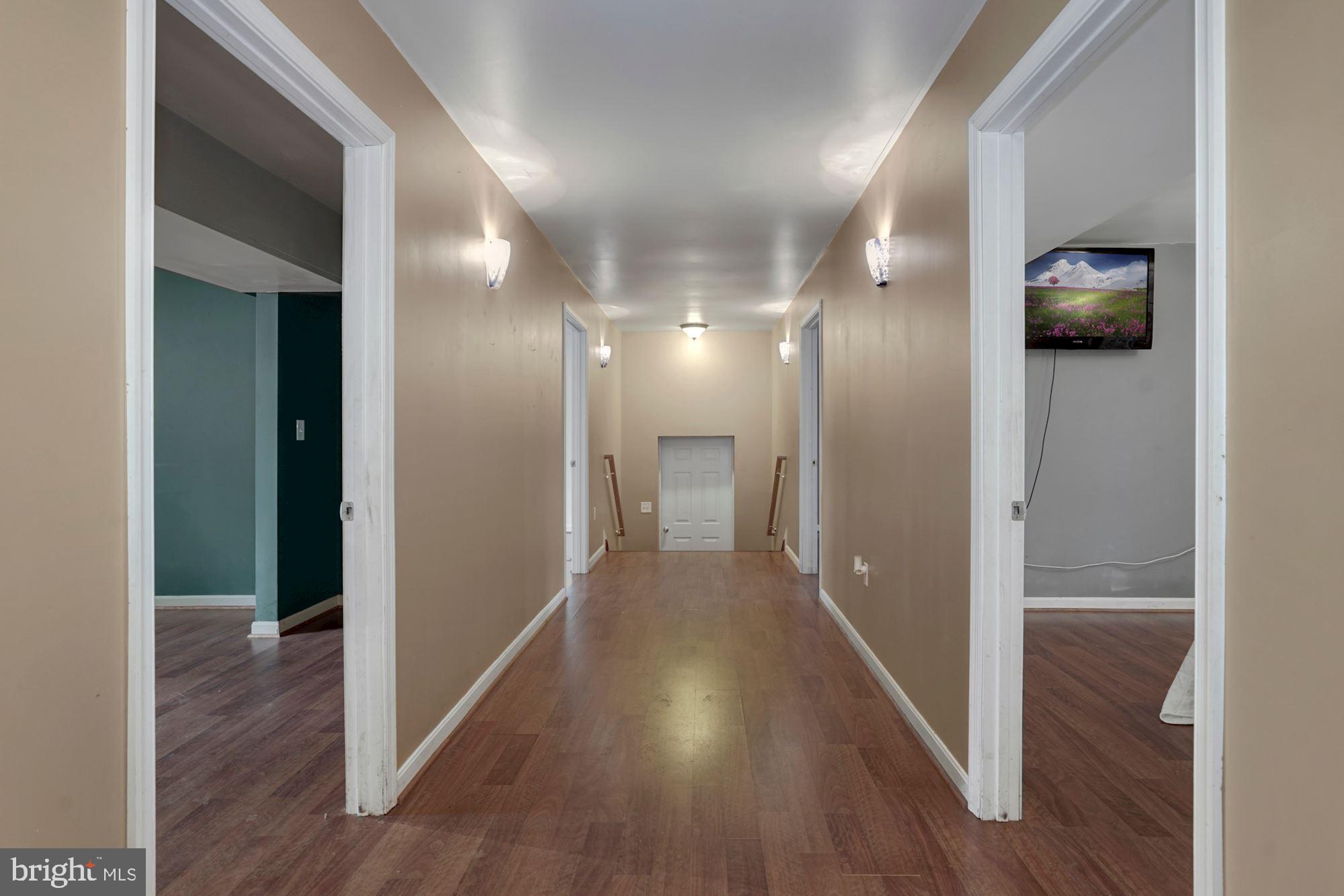 6823 Old Solomons Island Road Friendship, MD 20758 - Photo 9 of 41 Hall from 1st fl great room to bdrms/office/ garag