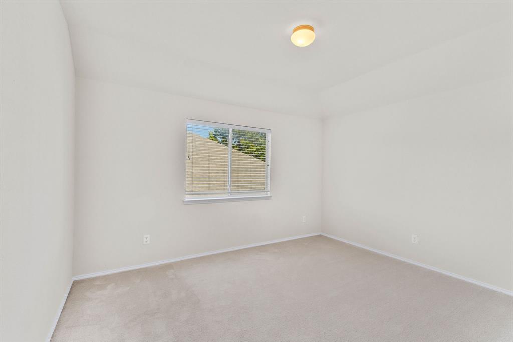 2700 Hereford Road Denton, TX 76210 - Photo 29 of 36 Carpeted room featuring a single window with horizontal blinds, light-toned walls, and a flush-mount ceiling light fixture