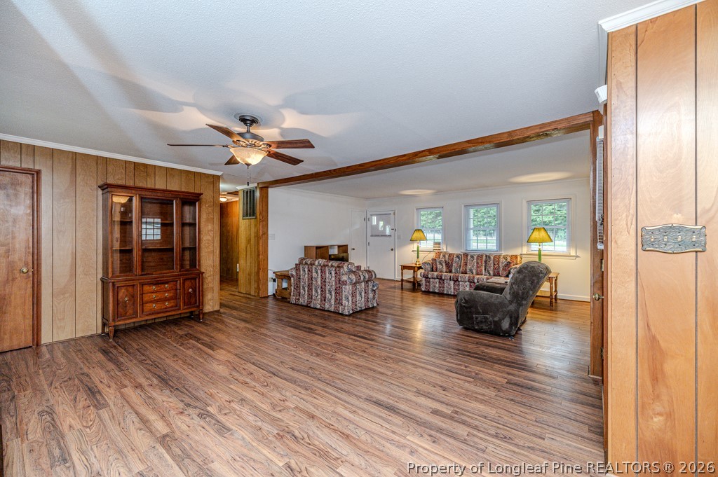 3384 Goldston Glendon Road Goldston, NC 27252 - Photo 17 of 47 a view of a livingroom with furniture and a ceiling fan