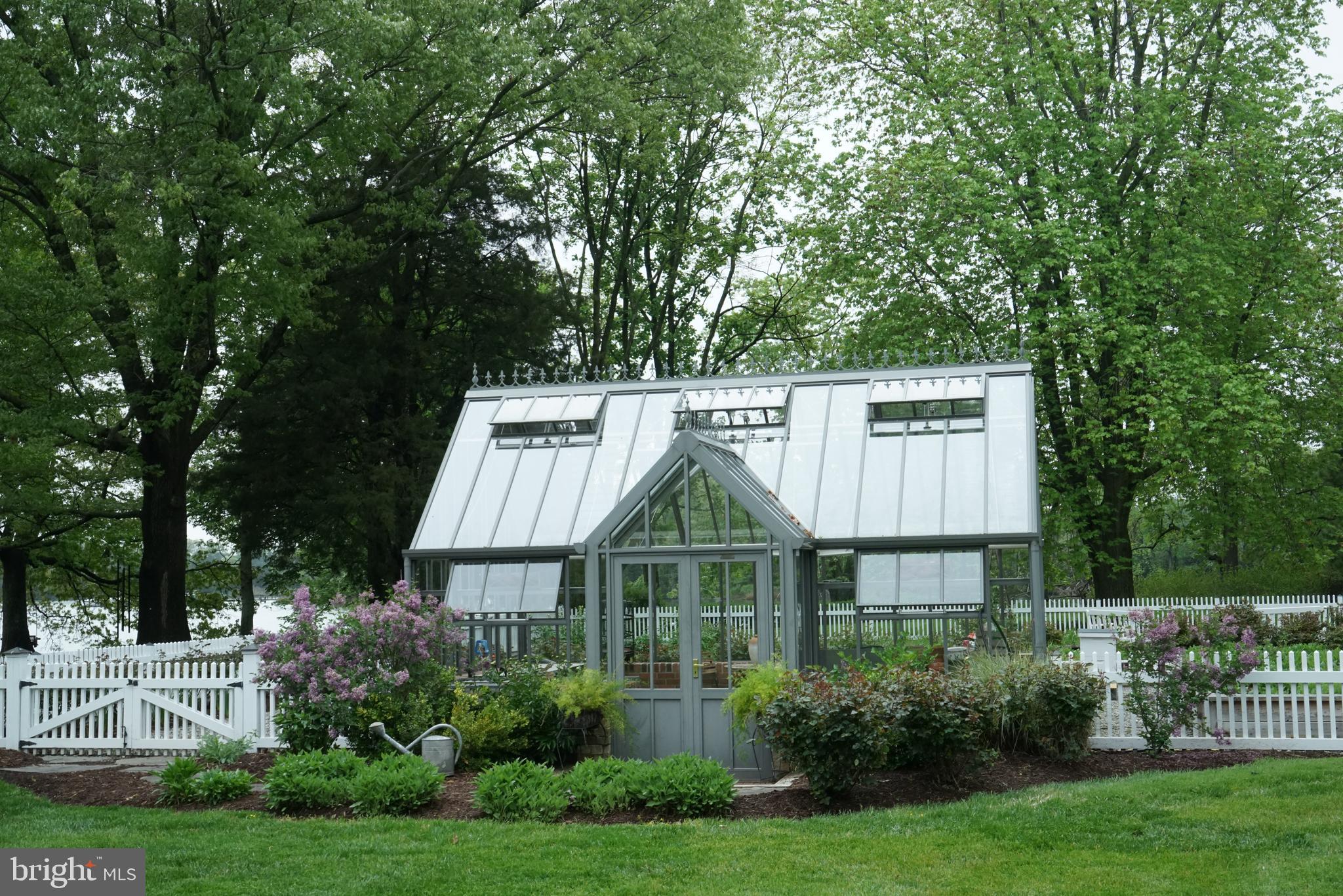 7508 Cooper Point Road Bozman, MD 21612 - Photo 110 of 116 Greenhouse with fenced raised garden beds