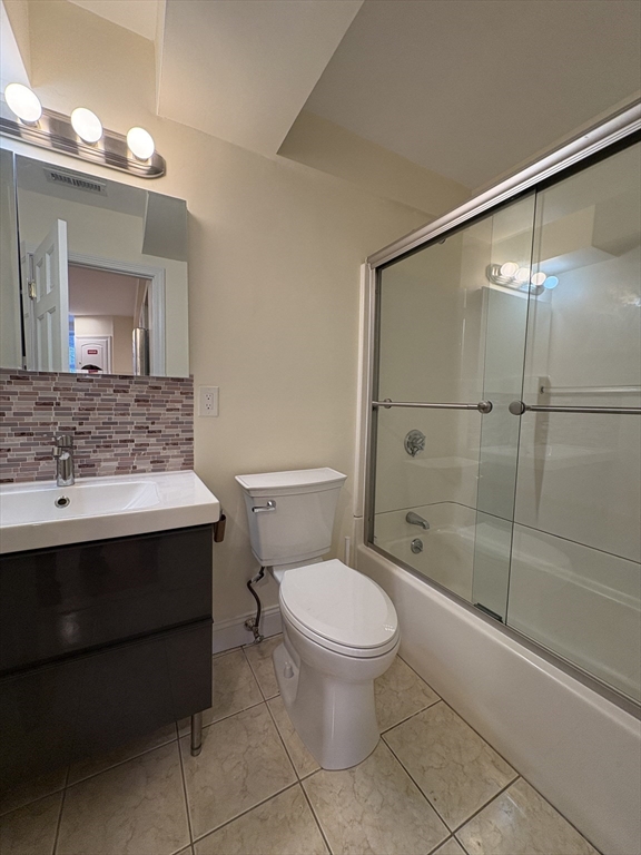 1801 Beacon Street, Unit 1 Brookline, MA 02445 - Photo 7 of 14 a bathroom with a sink toilet and shower