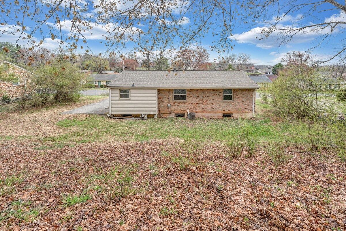 756 Kenyon Road Vinton, VA 24179 - Photo 14 of 14 a view of a house with a yard and hanging chair