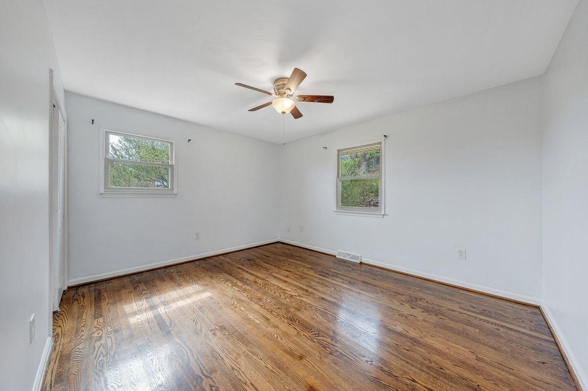 756 Kenyon Road Vinton, VA 24179 - Photo 5 of 14 a view of empty room with wooden floor and fan