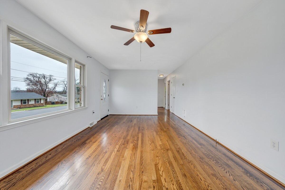 756 Kenyon Road Vinton, VA 24179 - Photo 8 of 14 a view of empty room with wooden floor and fan