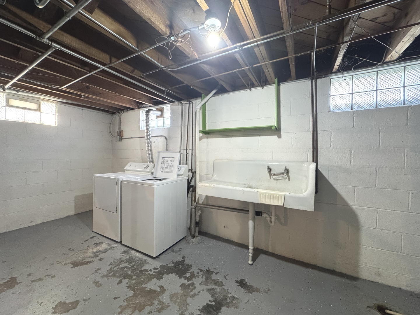 665 South May Avenue Kankakee, IL 60901 - Photo 10 of 22 a utility room with a sink a washer and dryer