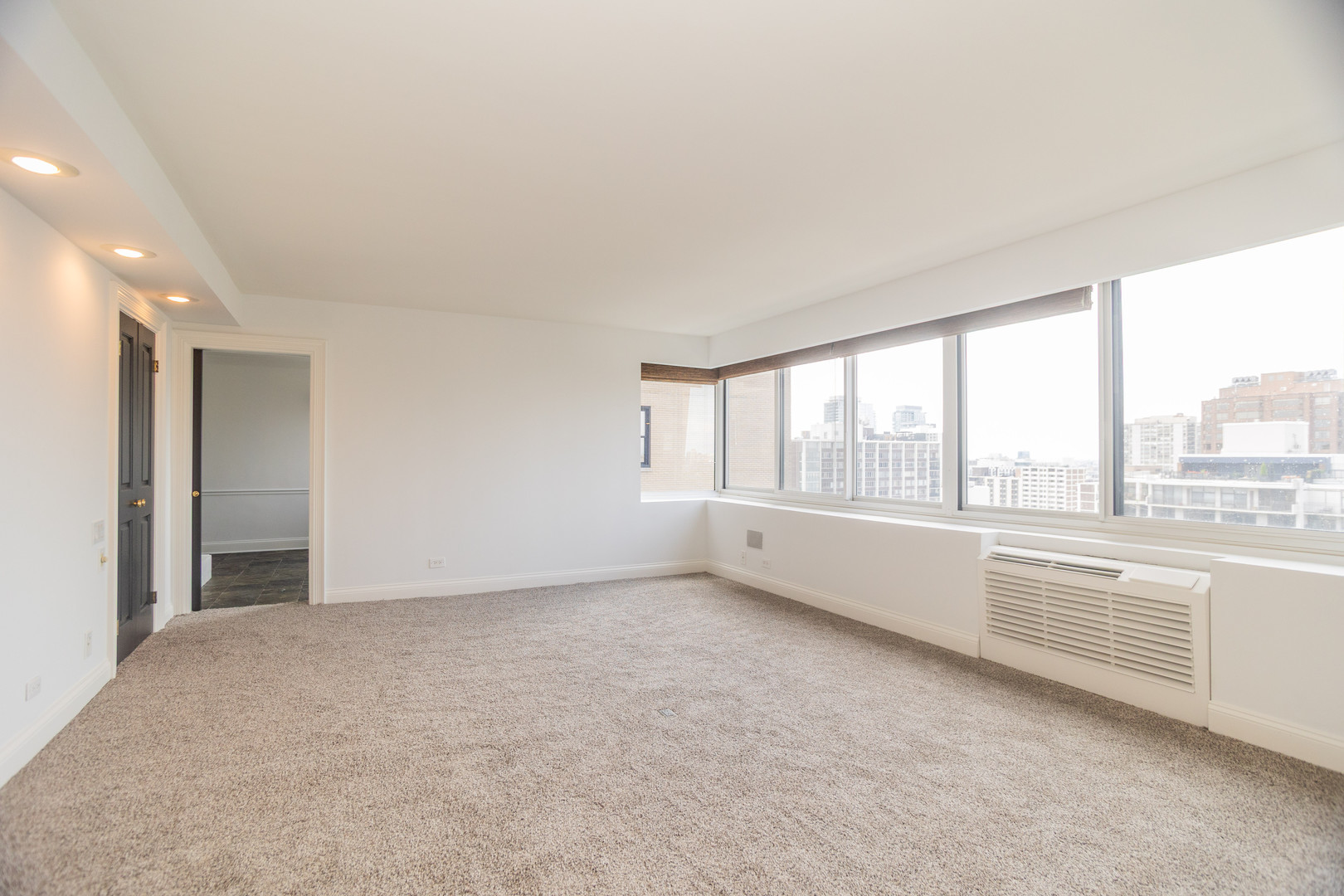 1440 North Lake Shore Drive, Unit 22ABCD Chicago, IL 60610 - Photo 13 of 21 a view of an empty room with a window