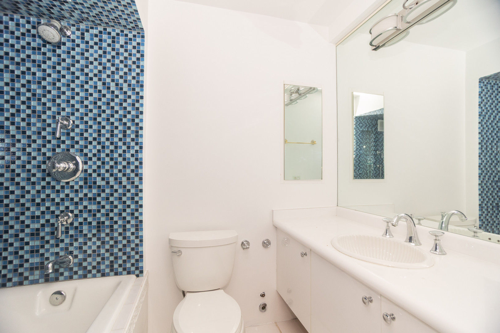 1440 North Lake Shore Drive, Unit 22ABCD Chicago, IL 60610 - Photo 17 of 21 a bathroom with a sink toilet and shower