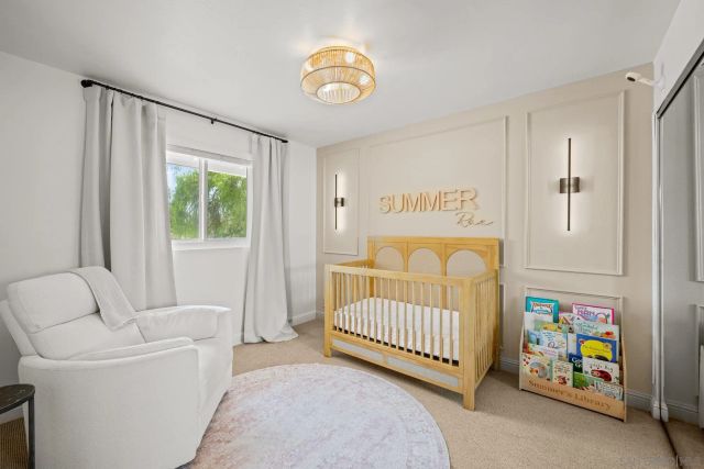 a bedroom with a bed and a couch