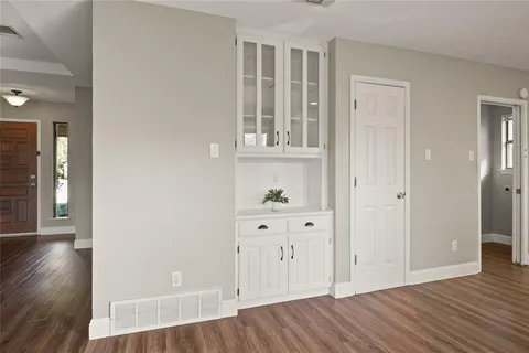 wooden floor with white walls