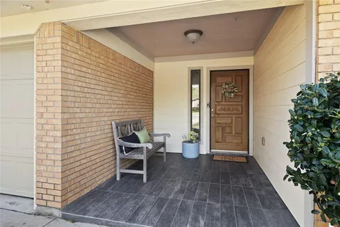 a view of a livingroom with furniture and front door
