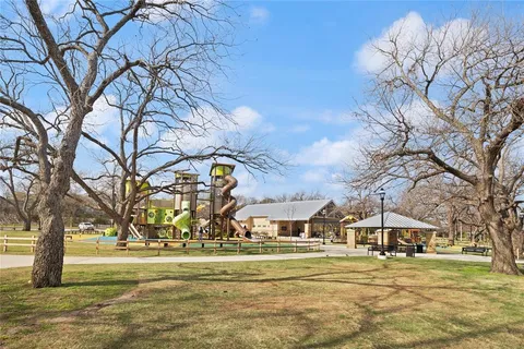 a backyard of a house with outdoor seating