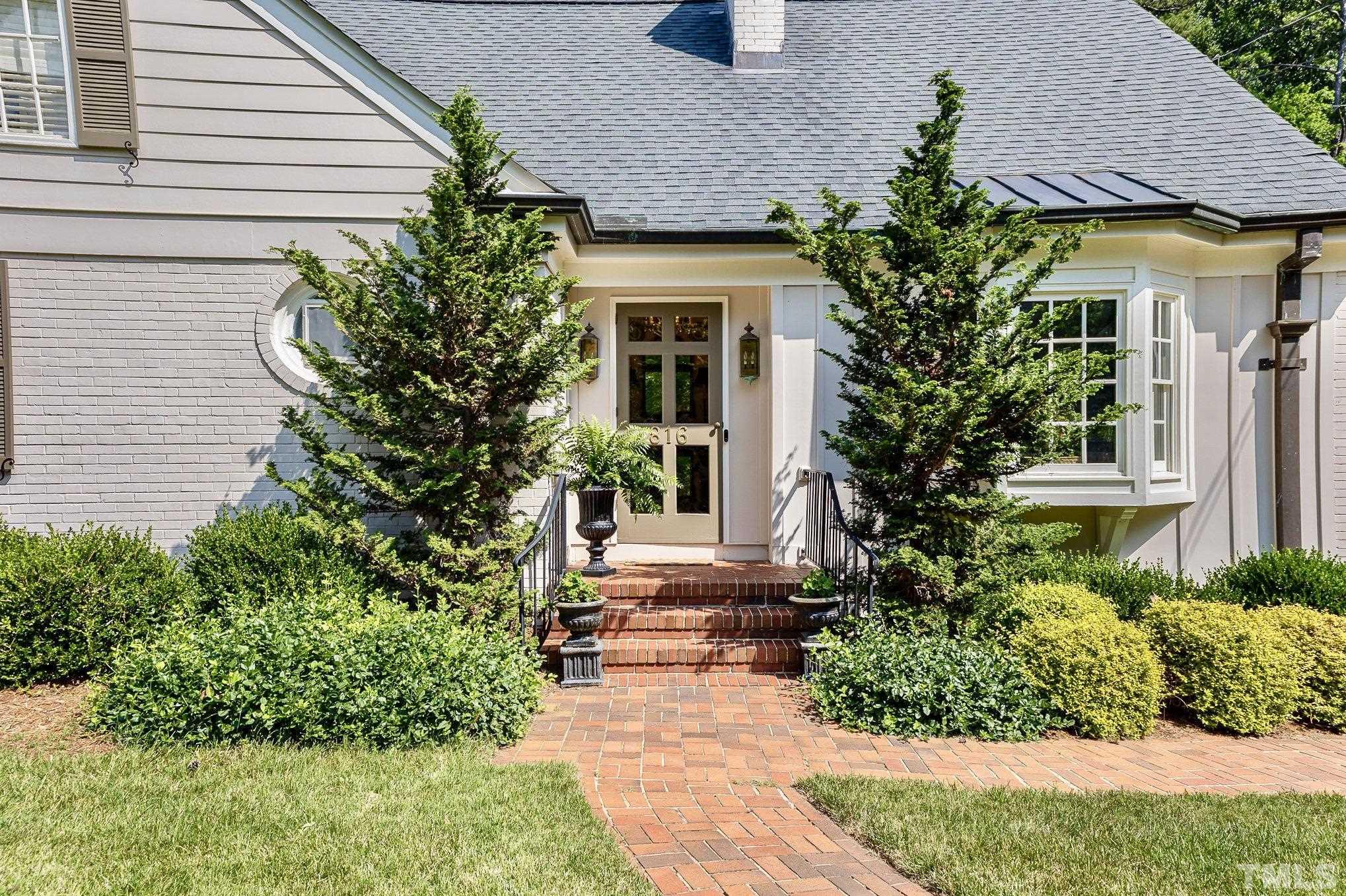 816 Lake Boone Trail Raleigh, NC 27607 - Photo 5 of 30 a front view of a house with plants and trees