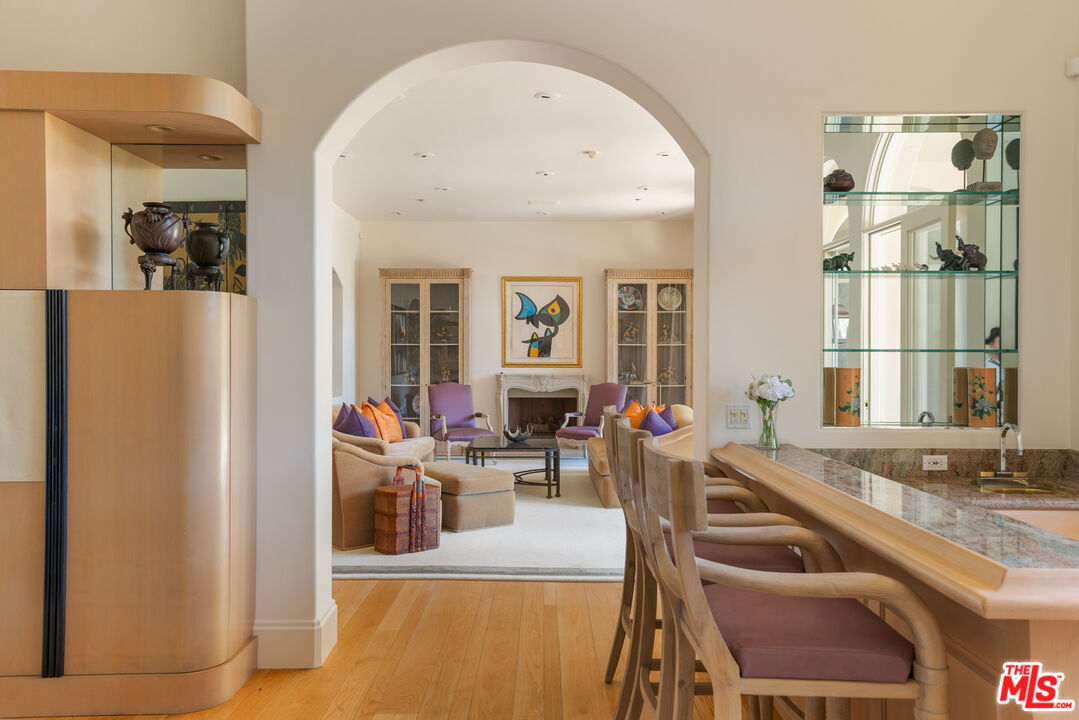 510 Doheny Road Beverly Hills, CA 90210 - Photo 11 of 24 a living room with furniture and a large window