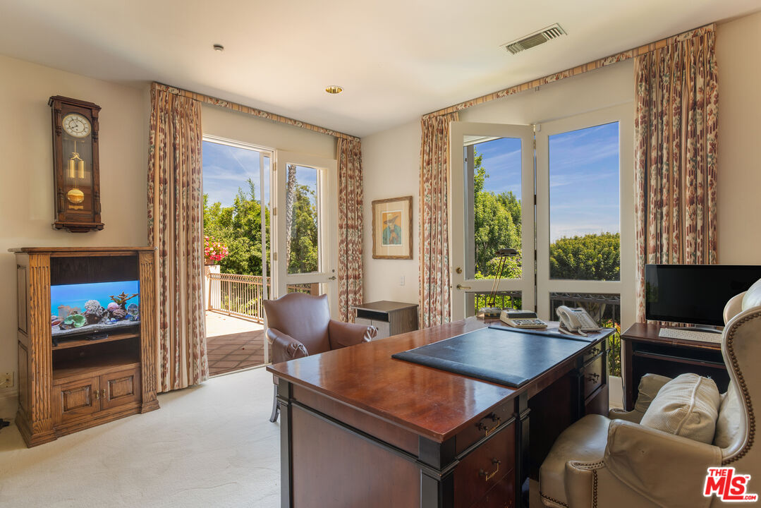 510 Doheny Road Beverly Hills, CA 90210 - Photo 21 of 24 a view of a livingroom with furniture window and outside view