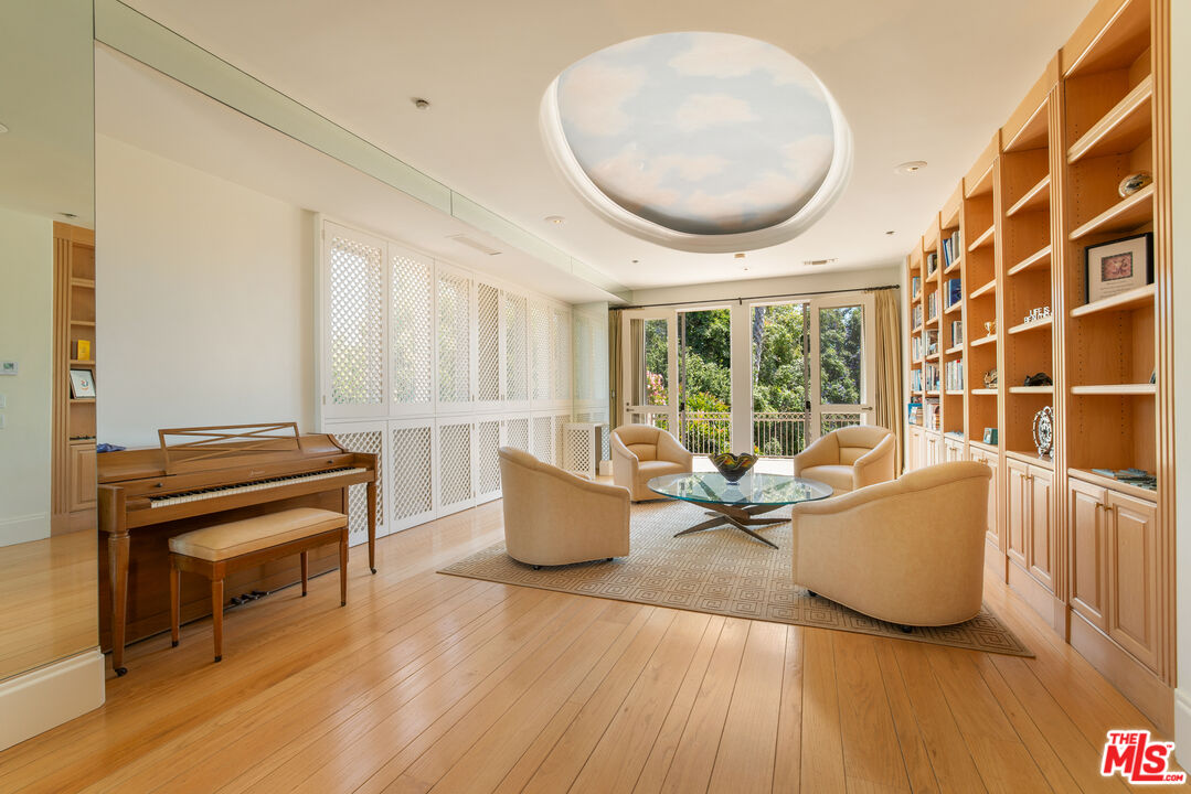 510 Doheny Road Beverly Hills, CA 90210 - Photo 23 of 24 a living room with furniture and a large window