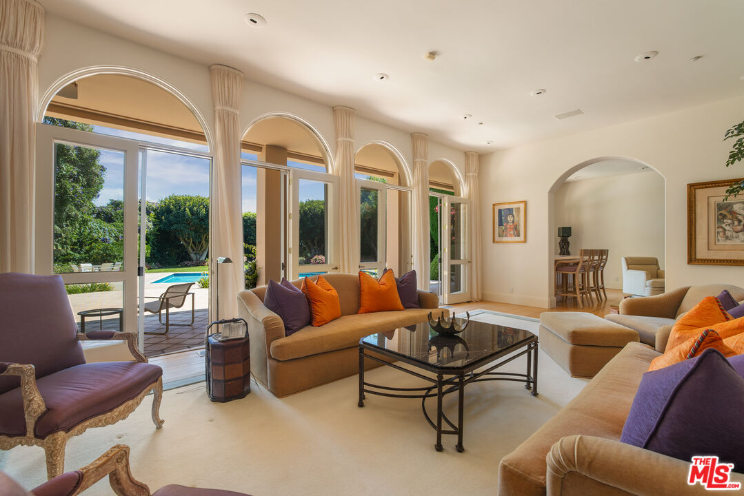 510 Doheny Road Beverly Hills, CA 90210 - Photo 5 of 24 a living room with furniture and a large window