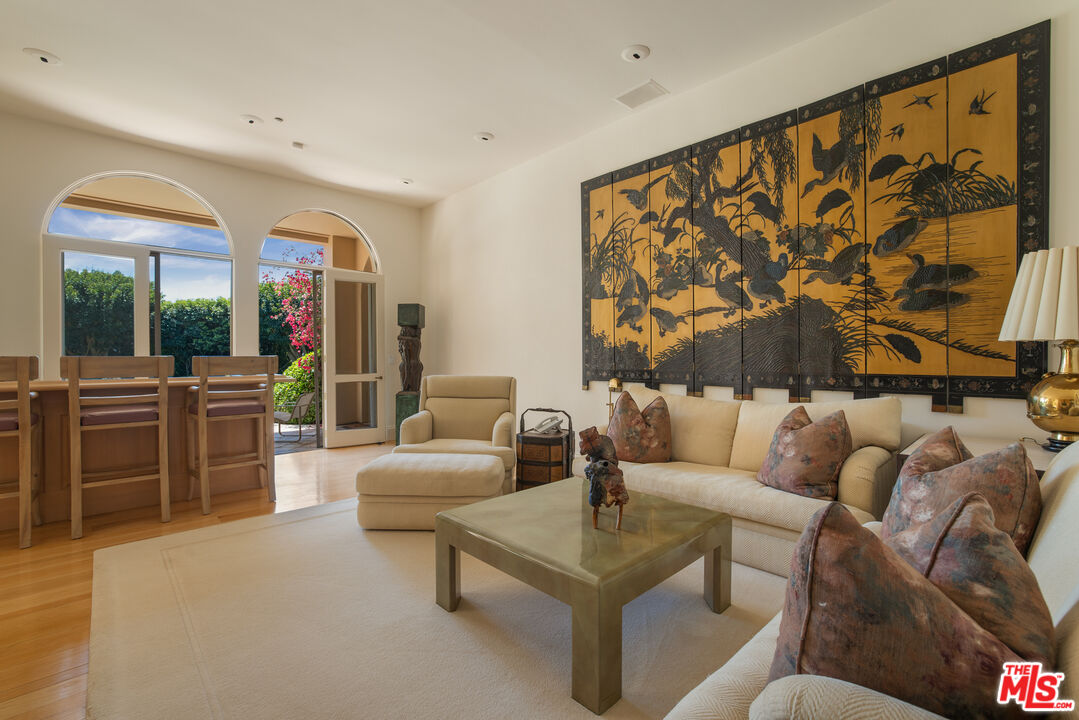 510 Doheny Road Beverly Hills, CA 90210 - Photo 6 of 24 a living room with furniture and a large window