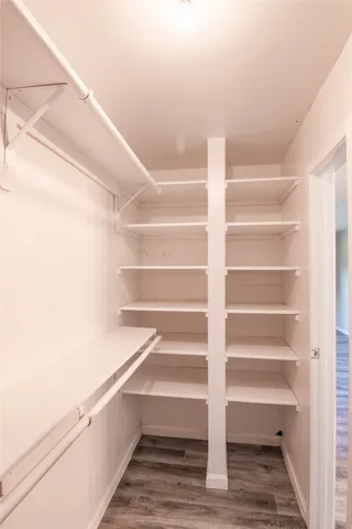 a view of an empty walk in closet