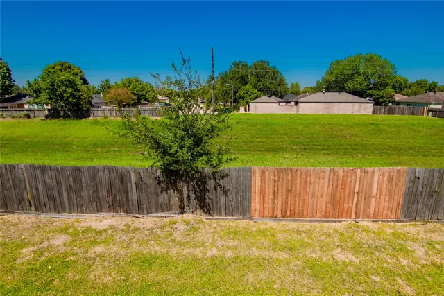 a view of swimming pool in front of house with outdoor space