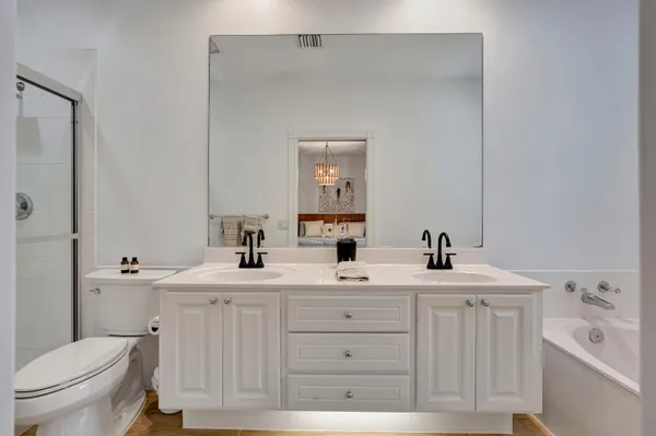 a bedroom with a bed and a couch