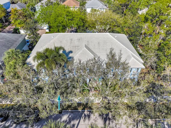 an aerial view of a house with a garden and outdoor space