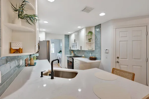 a view of hallway with washer and dryer