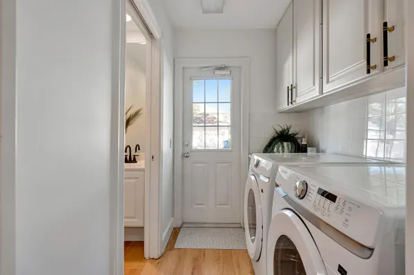 a bathroom with a sink a toilet and vanity