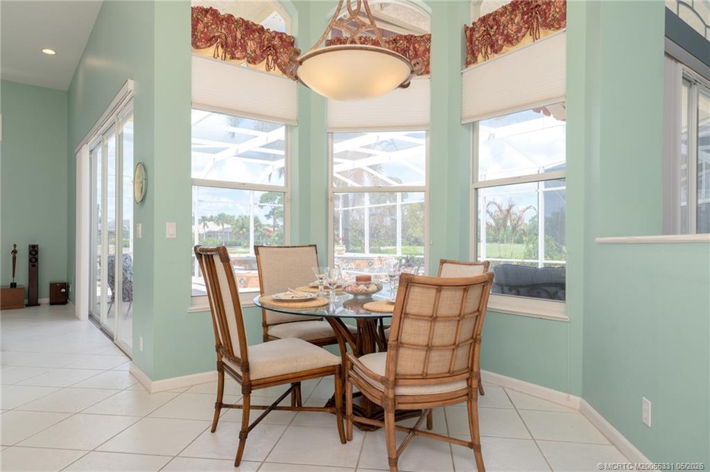 2216 Southeast Stonehaven Road Port St. Lucie, FL 34952 - Photo 15 of 67 a dining room with furniture and window