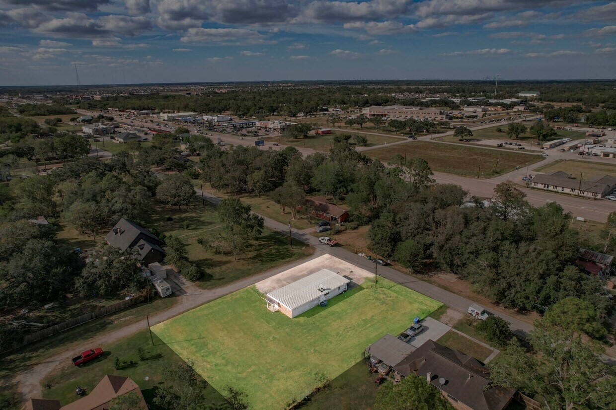 7430 Rodgers Road Manvel, TX 77578 - Photo 2 of 6 an aerial view of a house with a yard