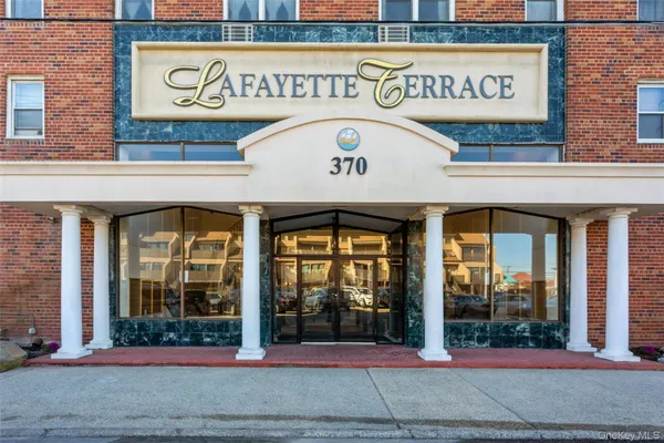 a view of a building with a street sign