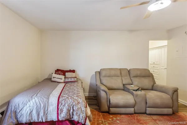 a bedroom with a bed and couch