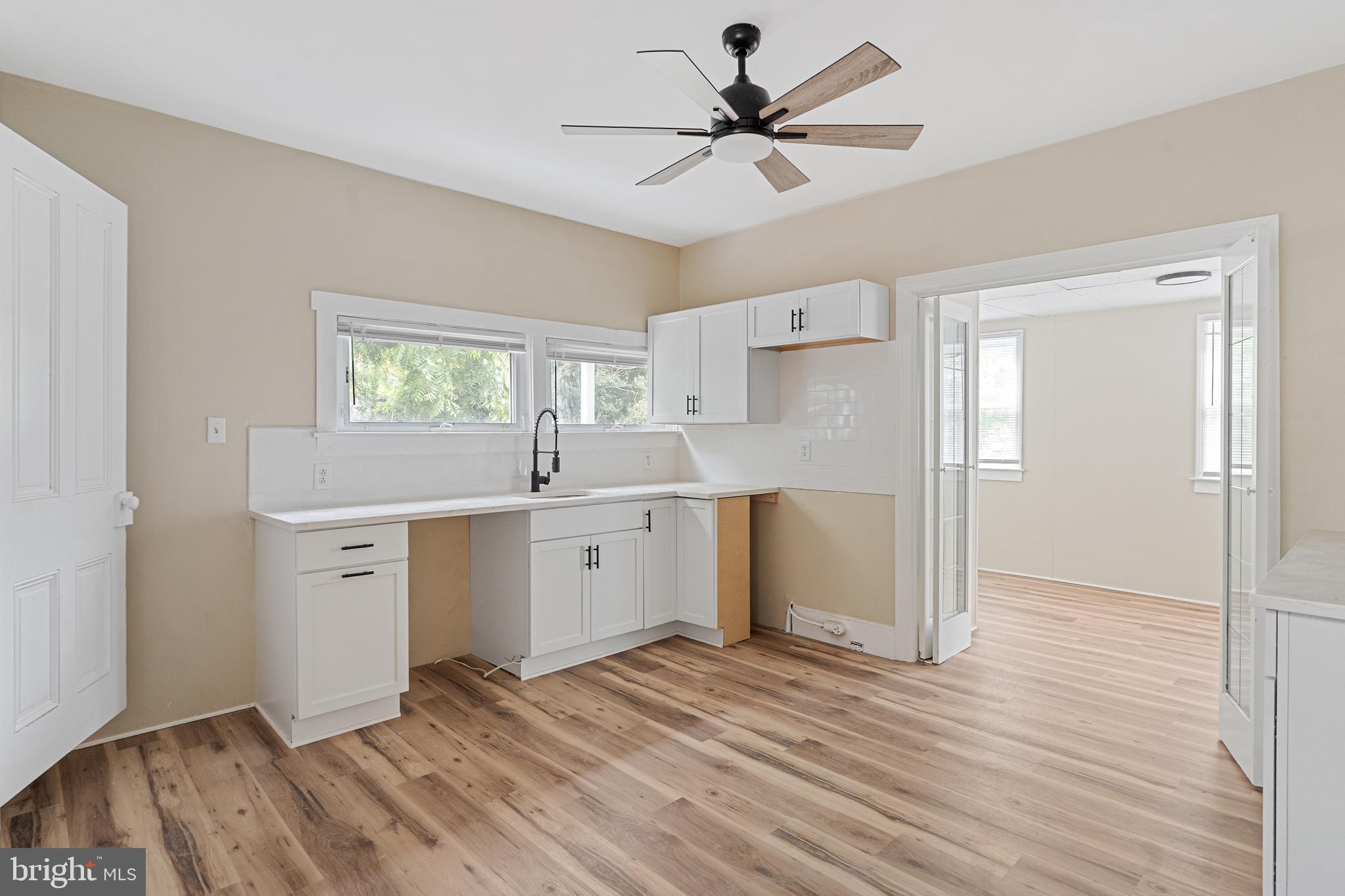 154 7th Street Salem, NJ 08079 - Photo 12 of 48 a view of a kitchen with a sink and a window