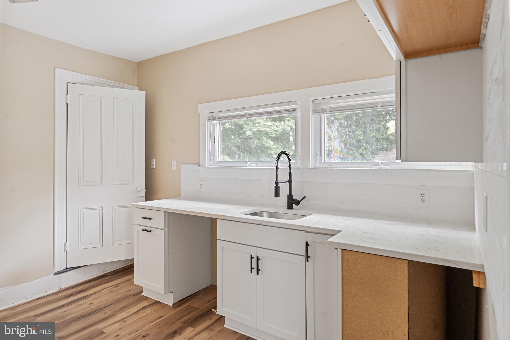 154 7th Street Salem, NJ 08079 - Photo 14 of 48 a kitchen with a sink cabinets and window