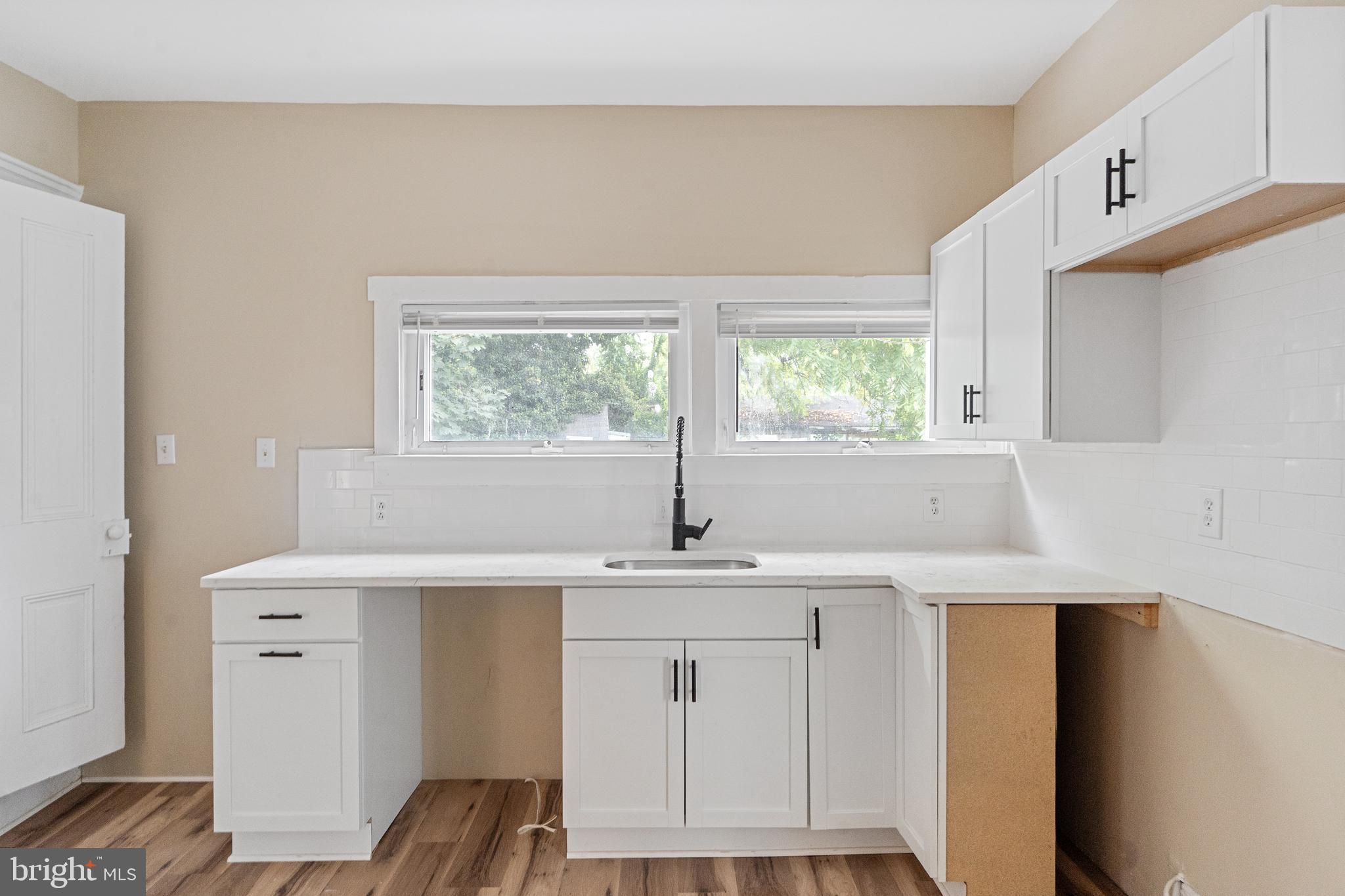 154 7th Street Salem, NJ 08079 - Photo 16 of 48 a kitchen with a sink cabinets and window
