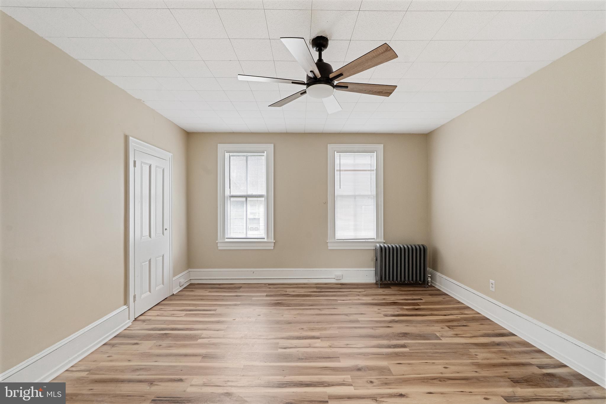 154 7th Street Salem, NJ 08079 - Photo 23 of 48 wooden floor in an empty room with a window