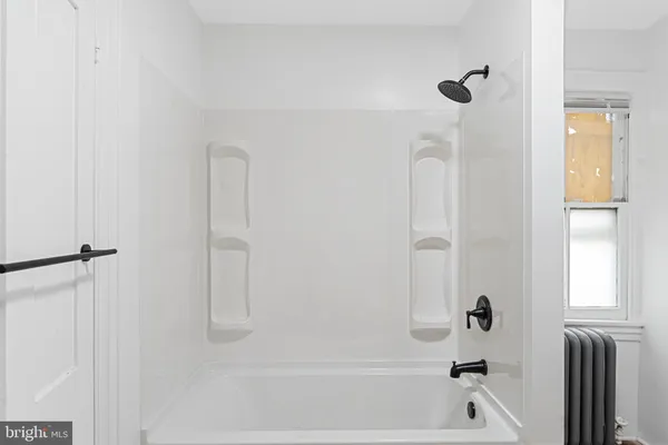 a bathroom with a bathtub