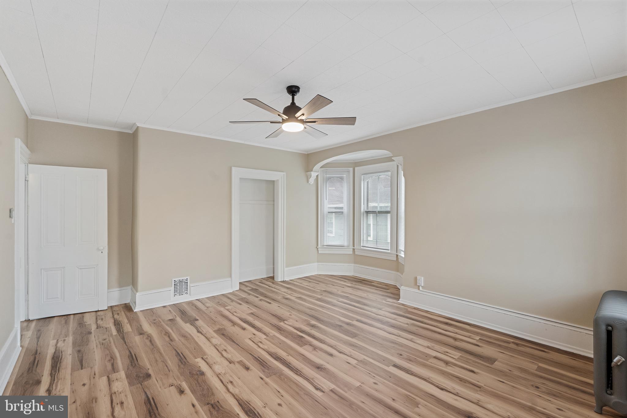 154 7th Street Salem, NJ 08079 - Photo 29 of 48 a view of a room with wooden floor and ceiling fan