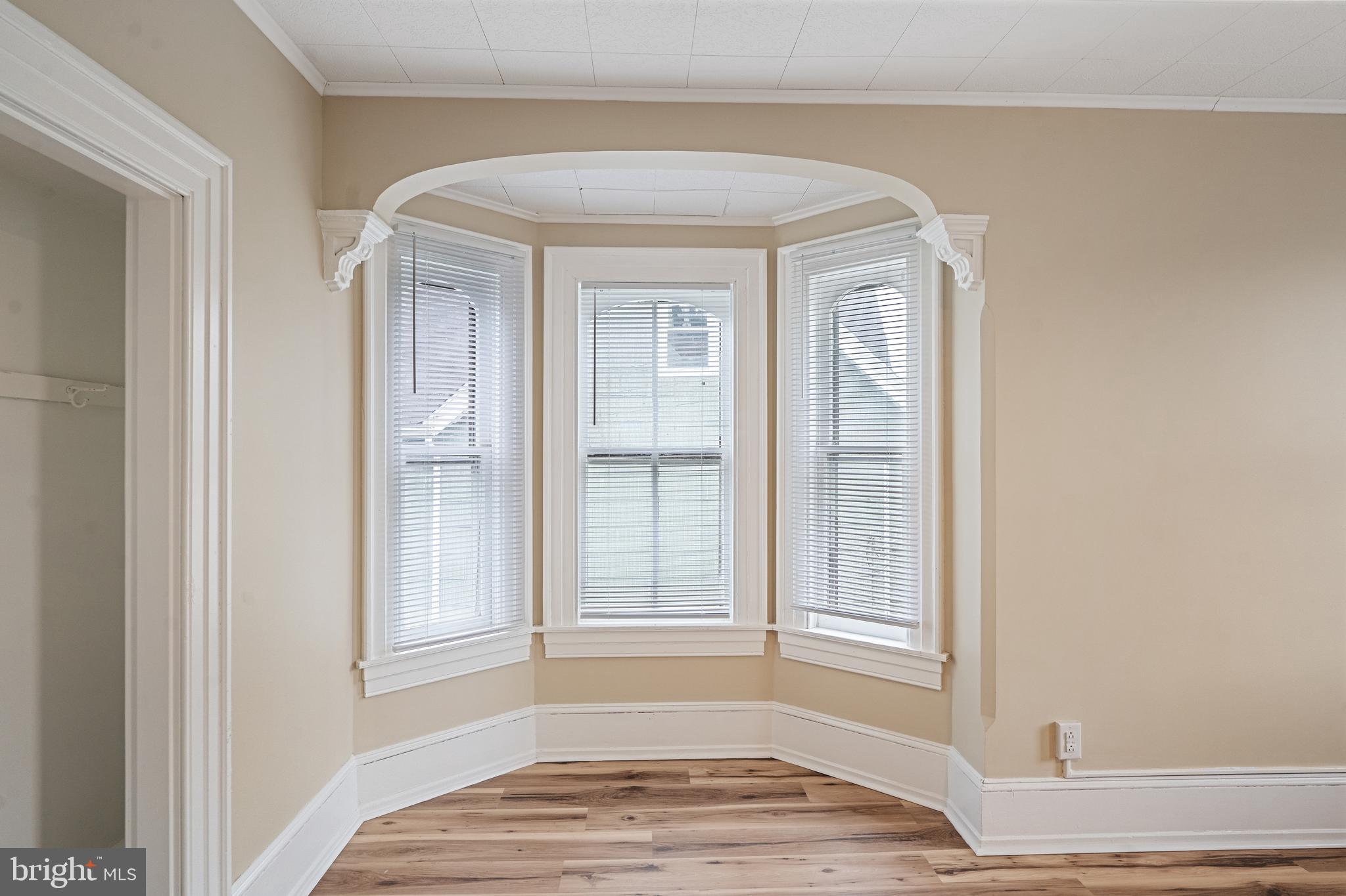 154 7th Street Salem, NJ 08079 - Photo 30 of 48 a view of wooden floor and windows in a room