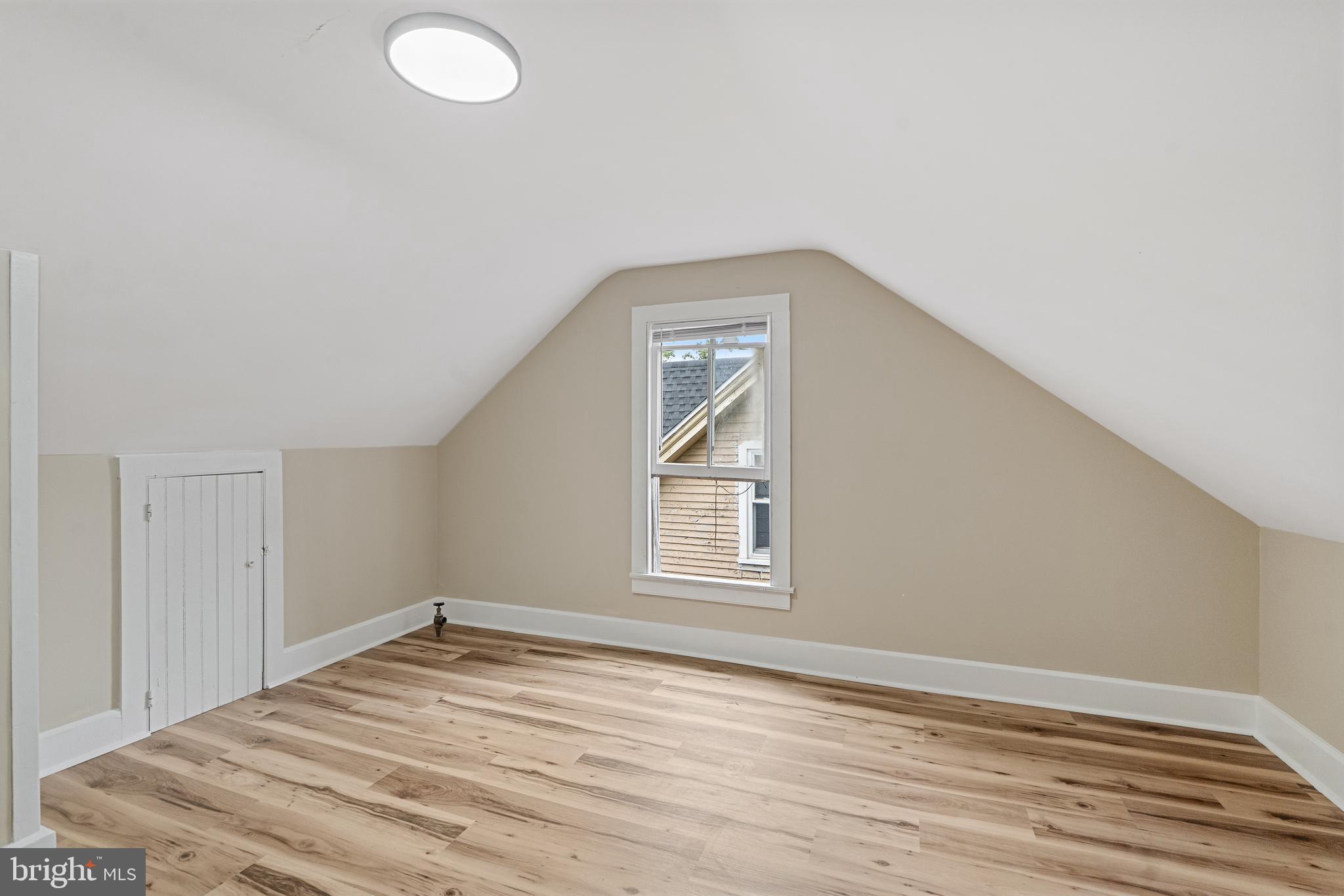 154 7th Street Salem, NJ 08079 - Photo 35 of 48 an empty room with wooden floor and windows