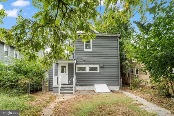 front view of a house with a tree