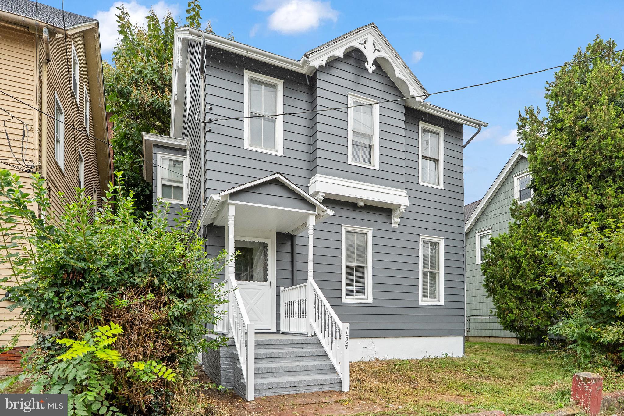 154 7th Street Salem, NJ 08079 - Photo 42 of 48 a view of a house with a yard and potted plants