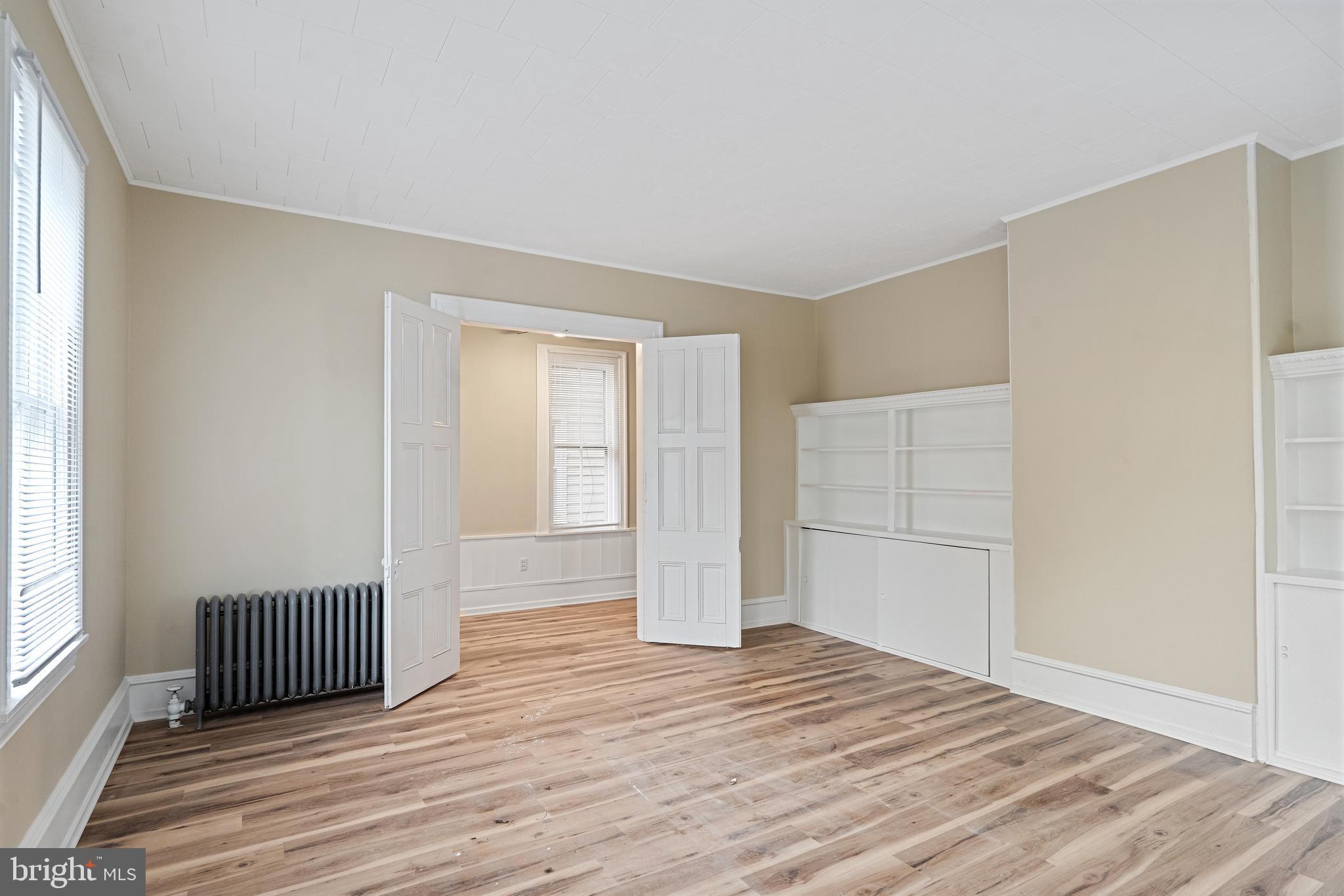 154 7th Street Salem, NJ 08079 - Photo 5 of 48 a view of a room with wooden floor and closet