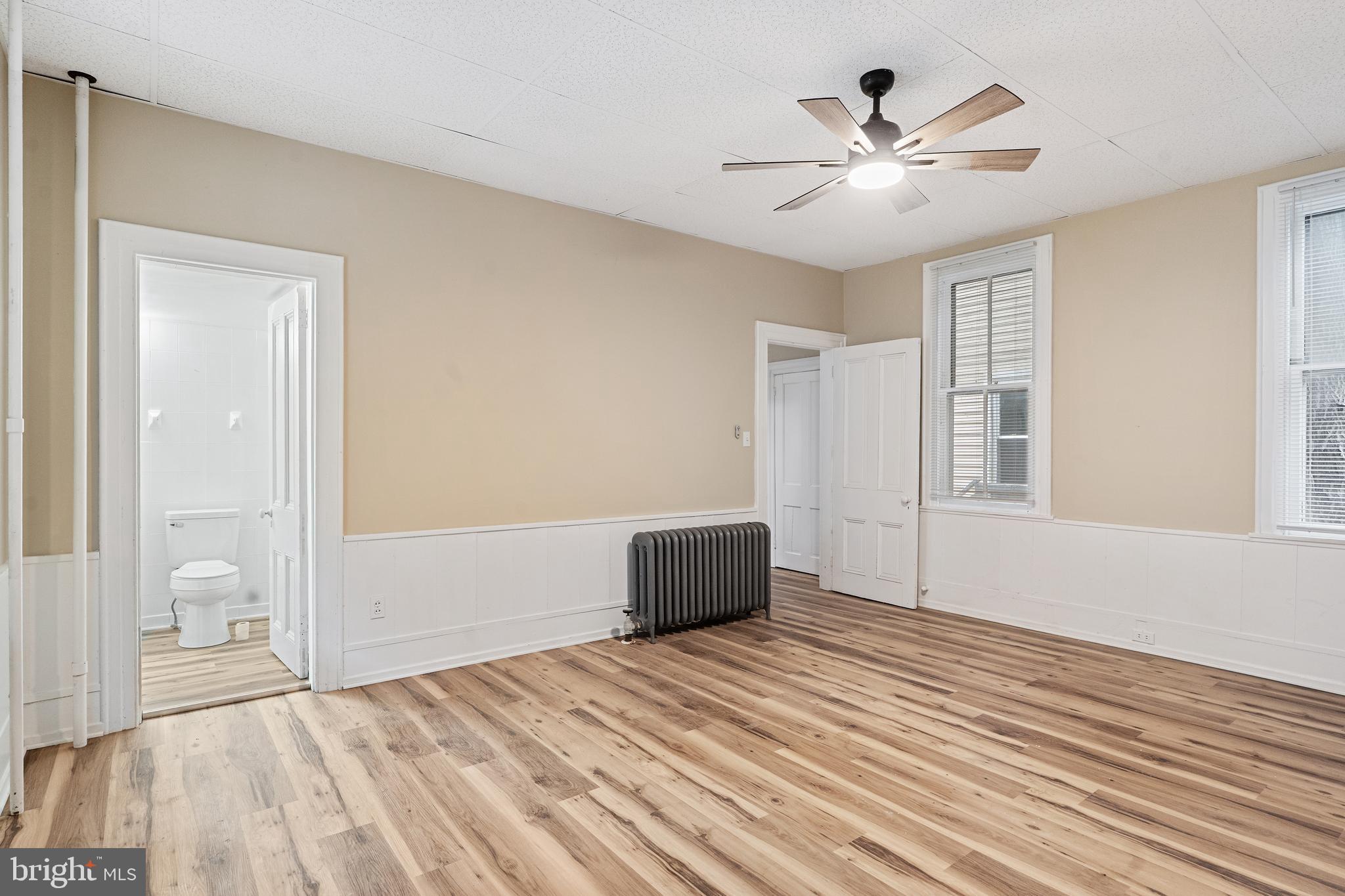 154 7th Street Salem, NJ 08079 - Photo 9 of 48 a view of an empty room with wooden floor