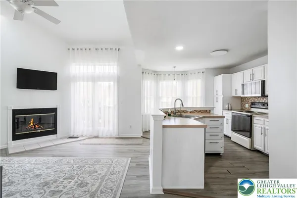 a kitchen with a stove and a refrigerator