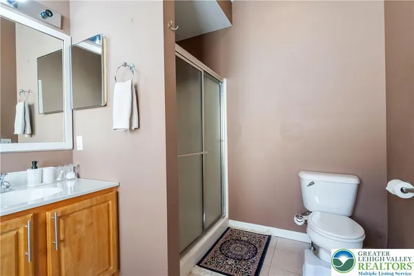 a bathroom with a toilet sink and shower