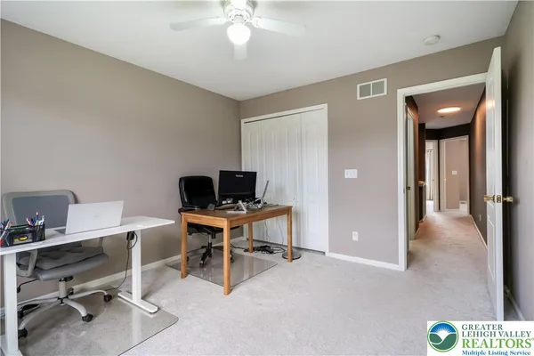 a view of a workspace with furniture