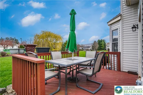 a view of a dinning table and chairs in patio