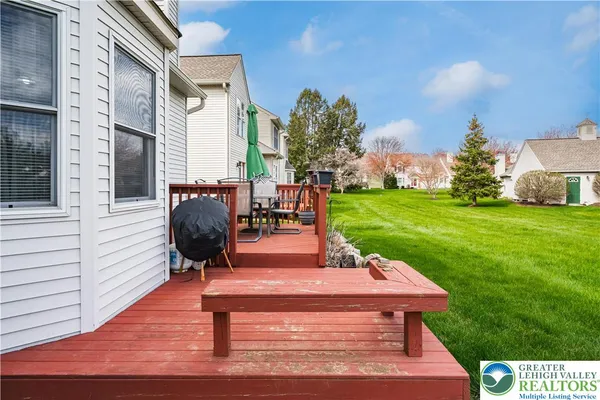 a view of a backyard with sitting area